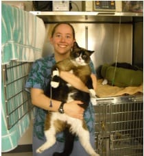 Animal hospital tech with fat cat